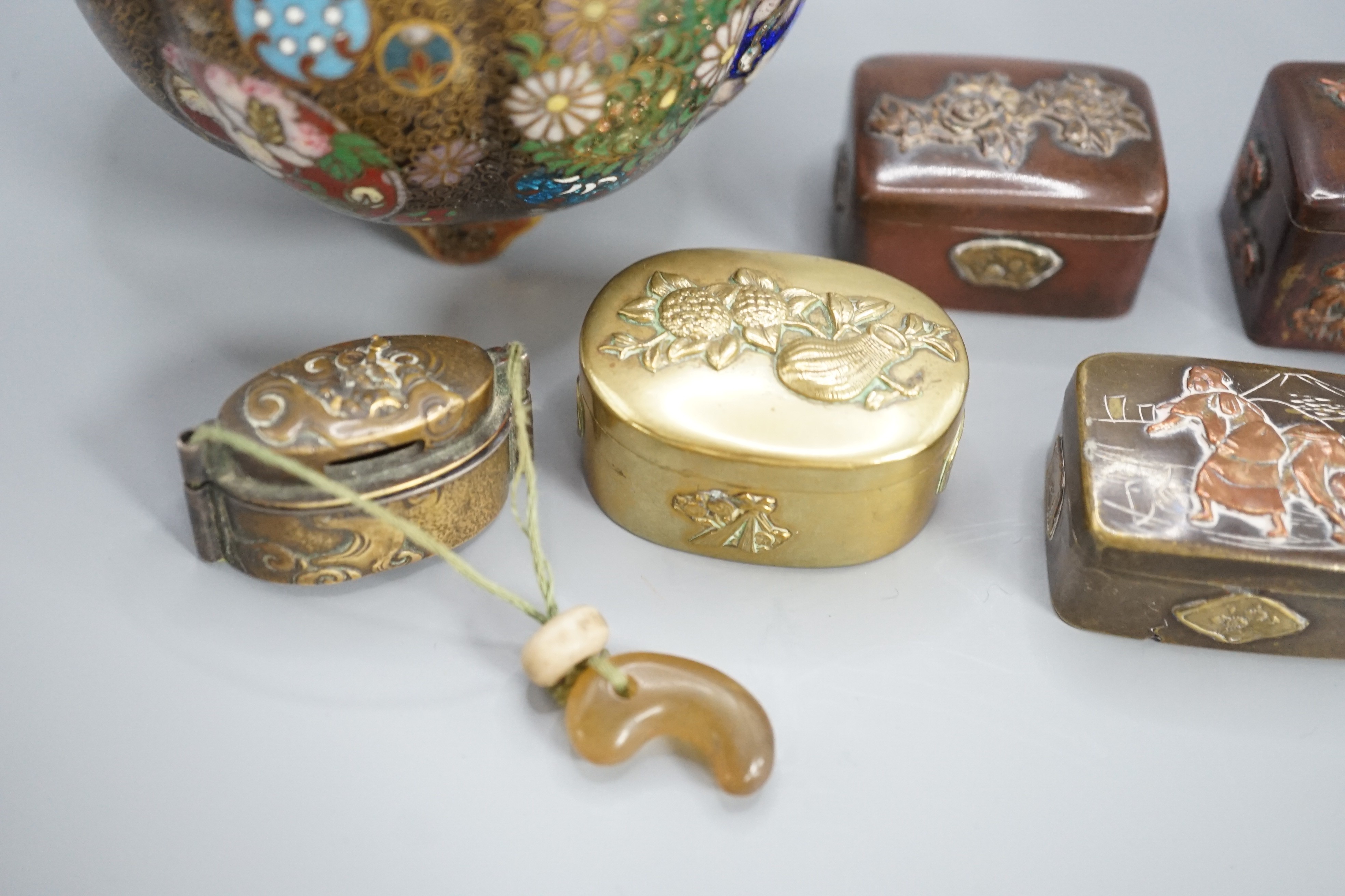 A Japanese cloisonne enamel koro and cover, 9.5 cm diameter and various Japanese mixed metal small boxes and covers, One made from Japanese sword fittings, signed, 4 cm